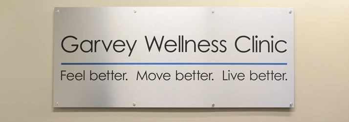 A sign displaying the Garvey Wellness Clinic logo
